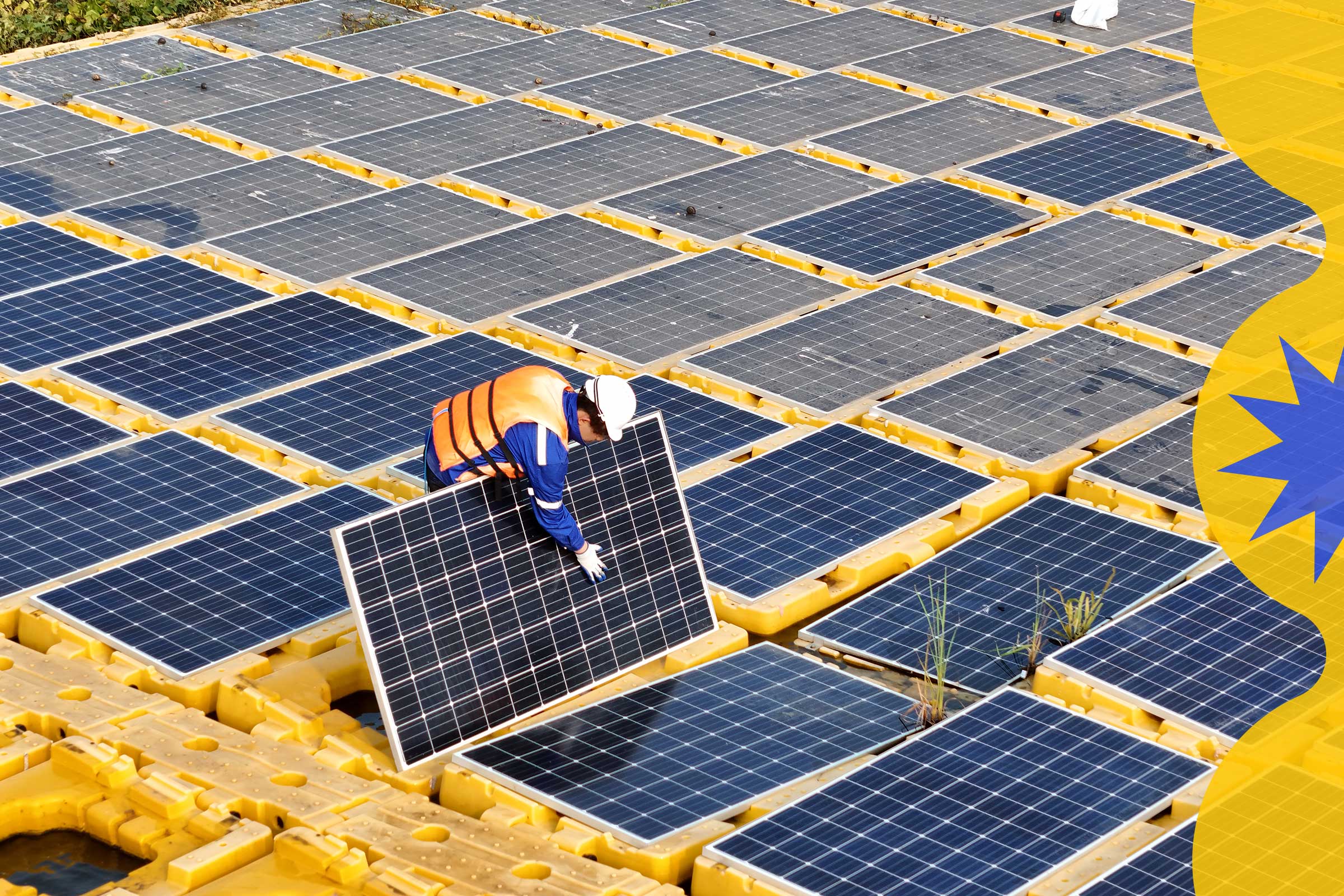 A technician inspects one solar panel in a vast array of panels.