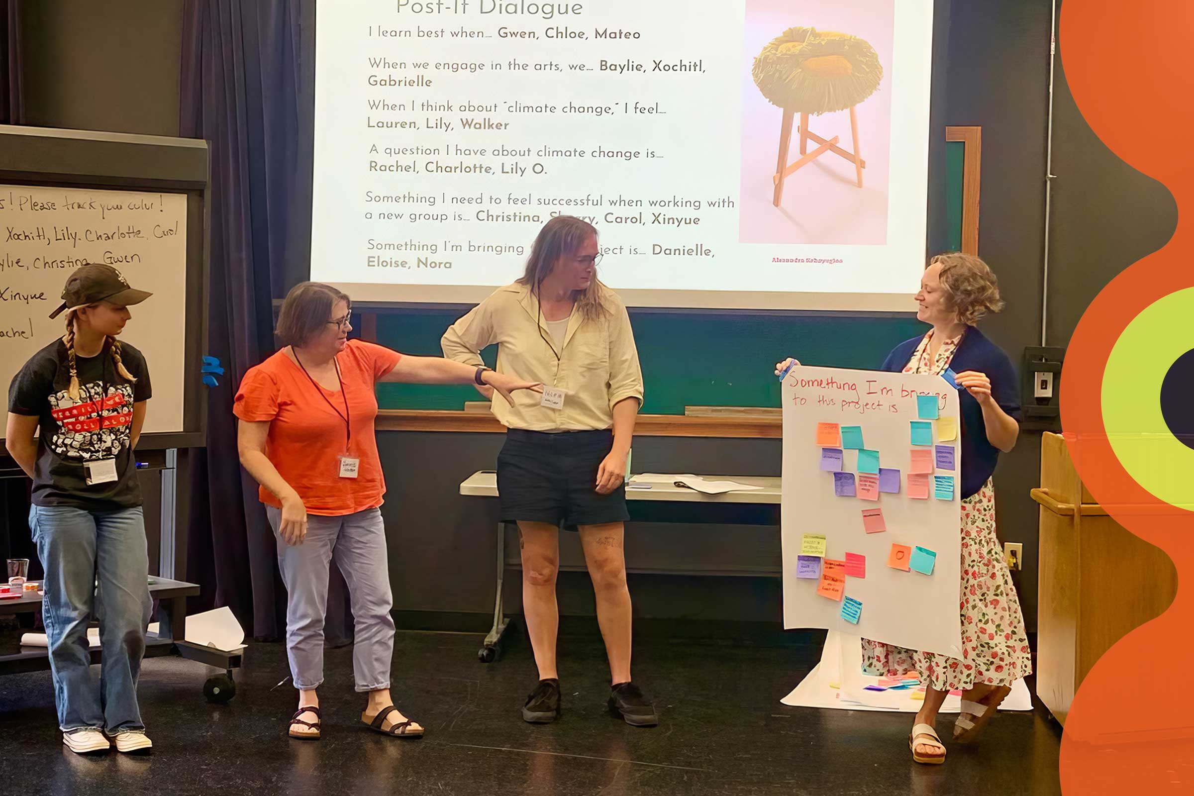 Women standing on stage presenting