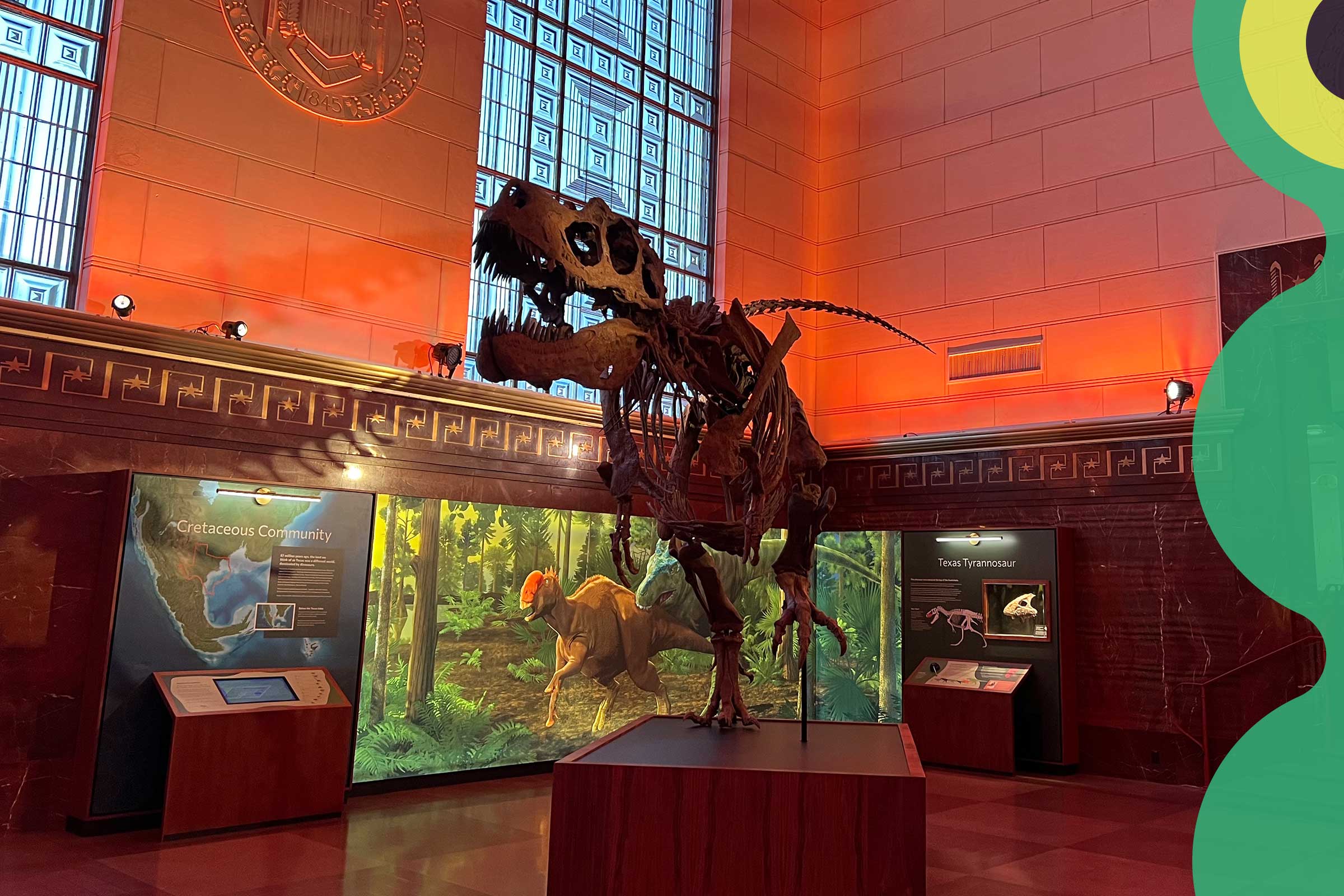 The T-Rex skeleton in a dimly lit museum.