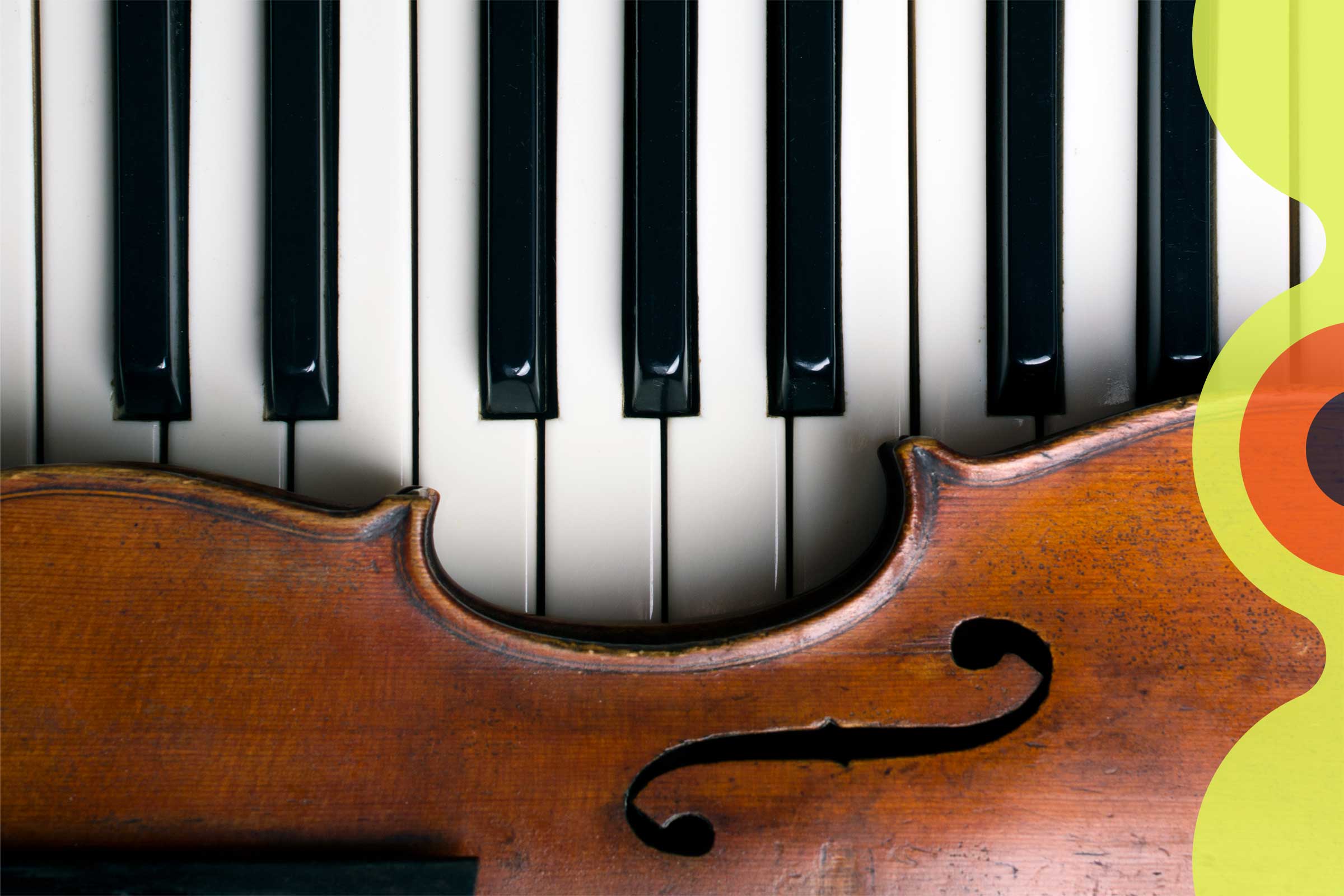 Violin sits on a piano keyboard