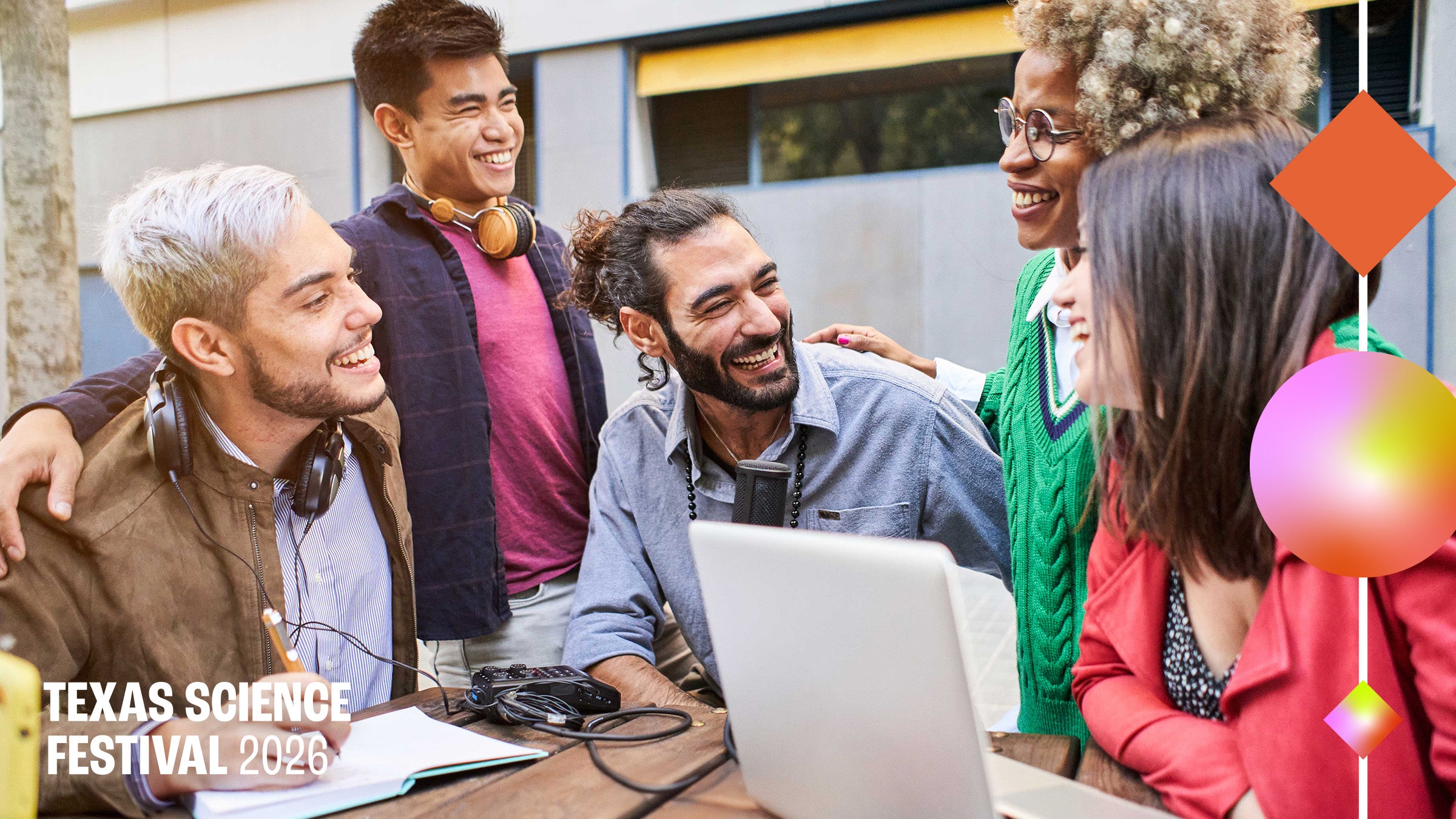 A group of science communicators gather around a table for conversation